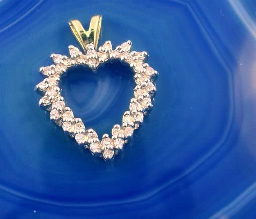 This is a wonderful 14kt YELLOW GOLD, (stamped), DIAMOND HEART PENDANT 