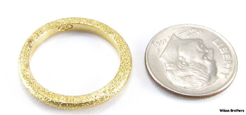 This ring weighs 3.9 grams . The face measures 3/32 (2.3mm) tall 